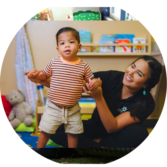 Brighton Center Therapist with Young Toddler Performing Physical Therapy