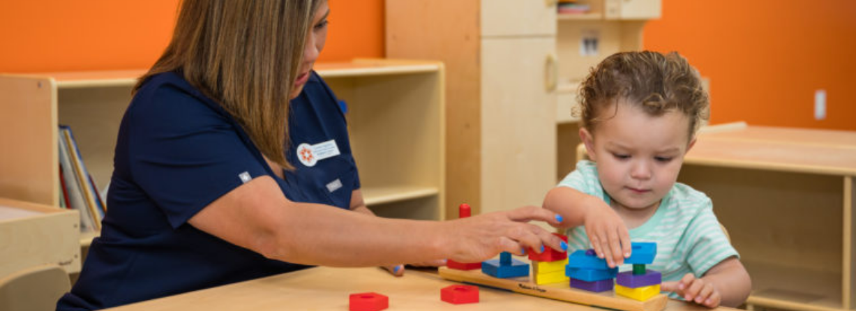 Young Child Learning with Brighton Center Therapist