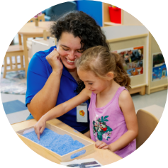 Brighton Center Therapist and Young Girl Having Fun Playing a Classroom Activity