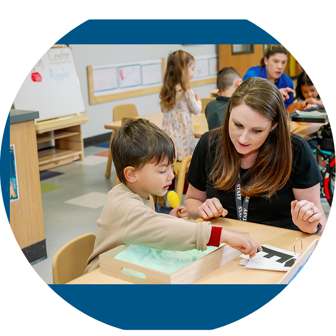 Brighton Center Therapist Engaging in Sensory Activity with Young Boy