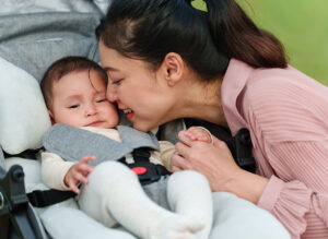 Mother Kissing with her Infant Baby