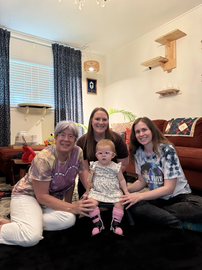 Marley Anne with her mom and grandmother in their living room