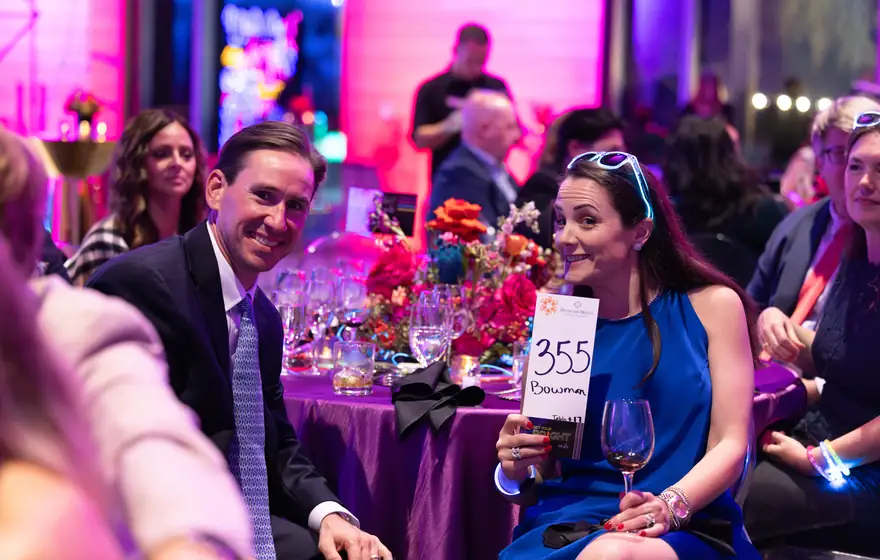 A table of guests during the live auction